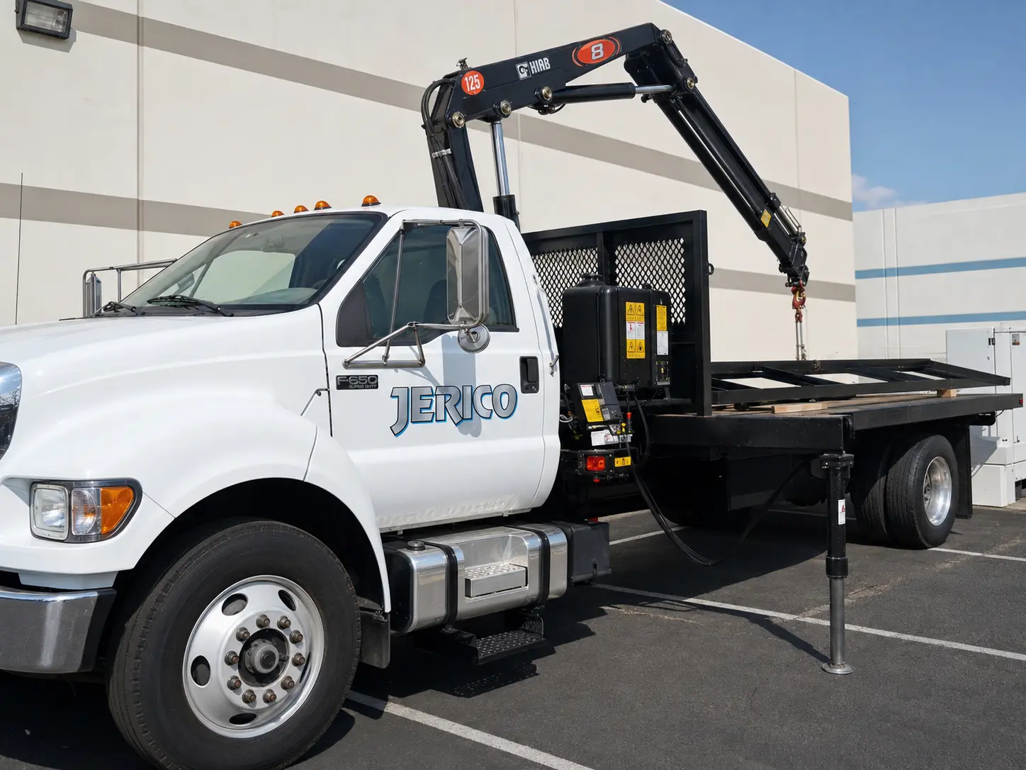 Jerico Specialty Metals flatbed truck equipped with a loading crane
